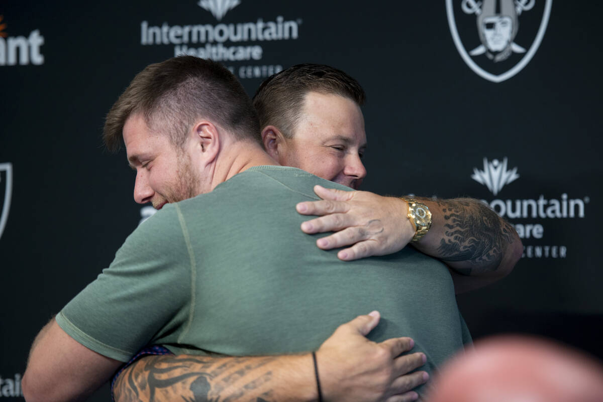 Las Vegas Raiders offensive guard Kolton Miller, left, hugs Richie Incognito after a press conf ...