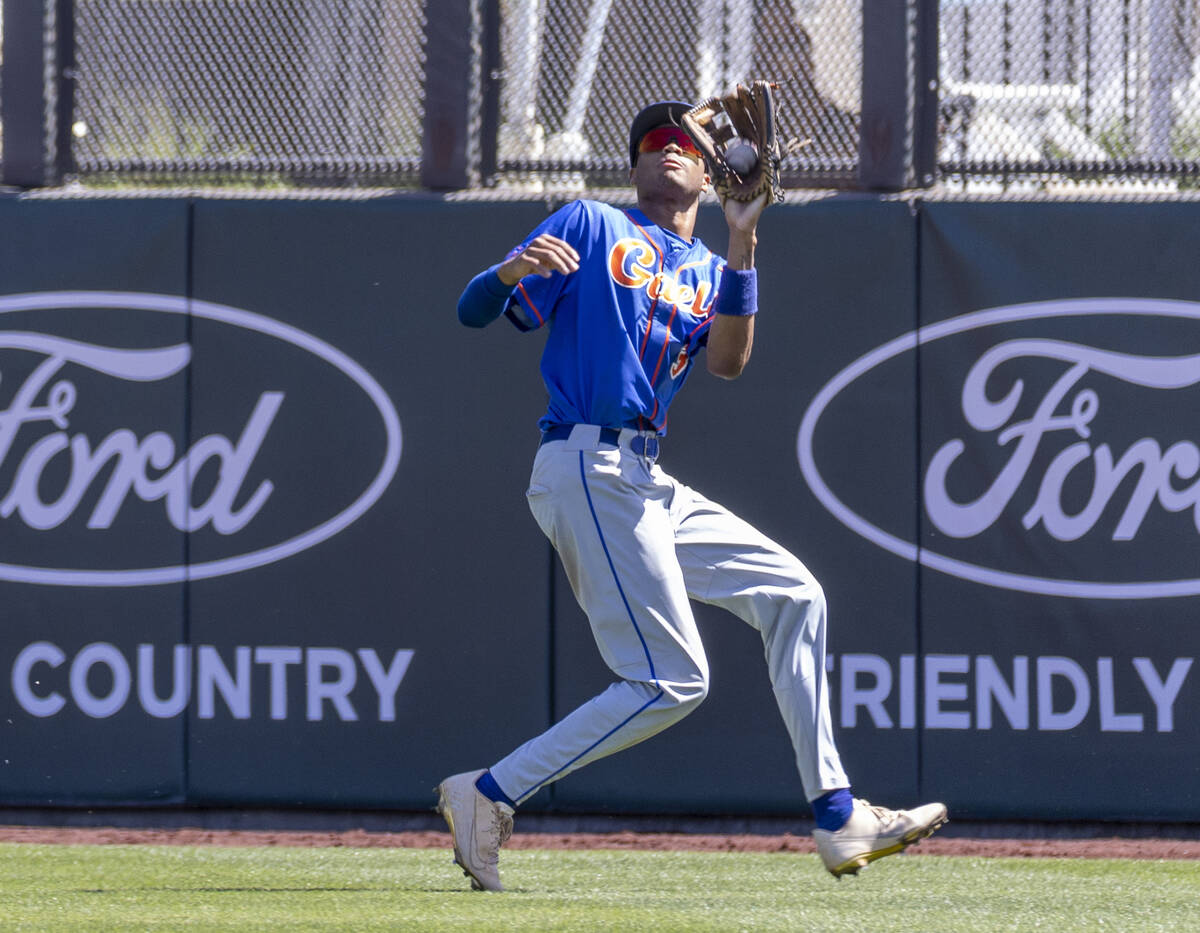 Bishop Gorman outfielder Justin Crawford secures a long fly ball (3) over Basic during their Cl ...