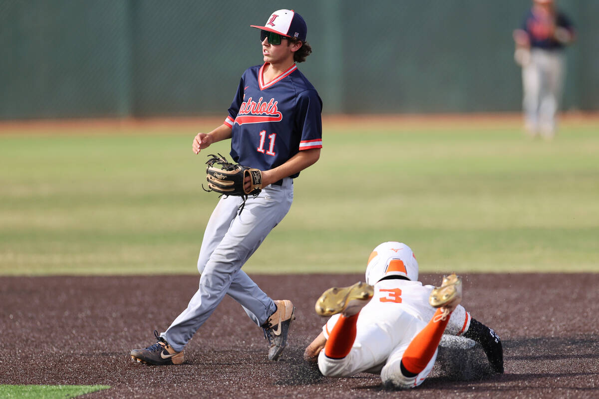 Bishop Gorman’s Justin Crawford (3) steals second base as Liberty’s Dylan Fisher ...