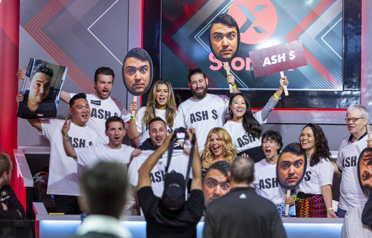 Fans of player Asher Conniff cheer him on during the start of final table play at the WSOP Main ...