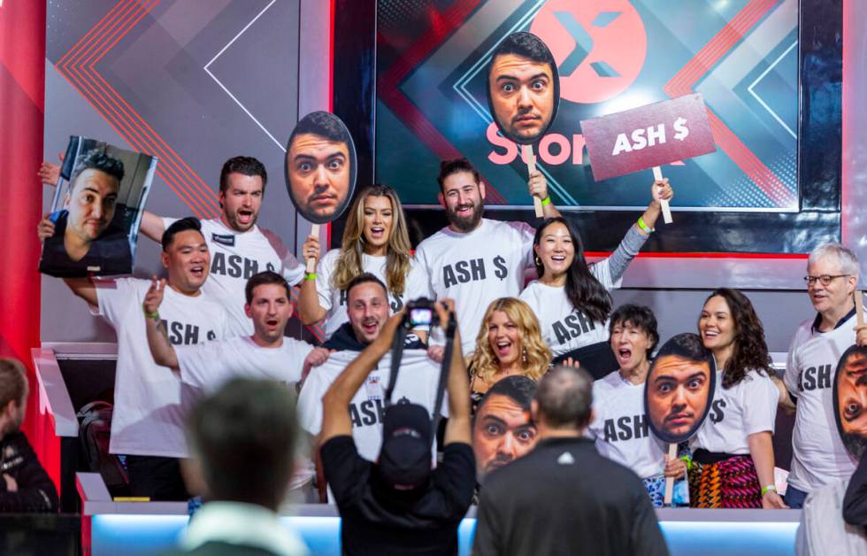 Fans of player Asher Conniff cheer him on during the start of final table play at the WSOP Main ...