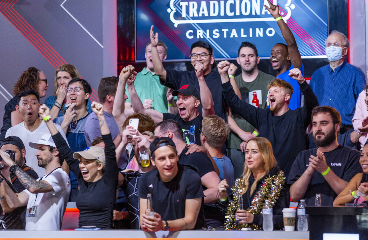 Fans of Matija Dobric cheer a winning hand during final table play at the WSOP Main Event withi ...