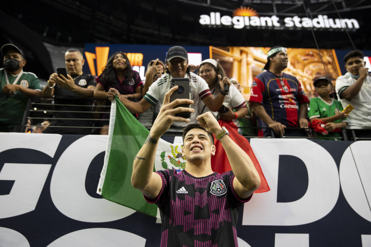 UFC flyweight champion Brandon Moreno takes photos with fans before the start of the Concacaf G ...