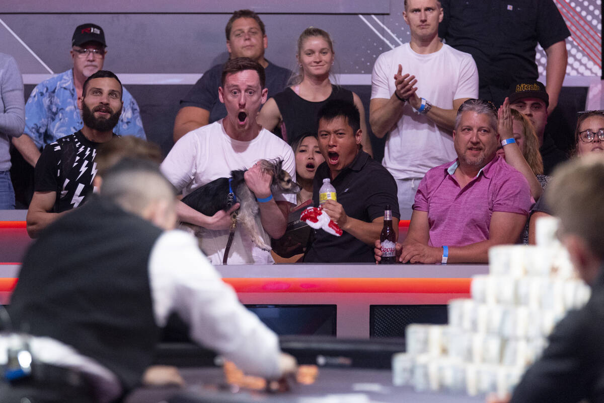 People watch players compete in the last table of the main event during the World Series of Pok ...