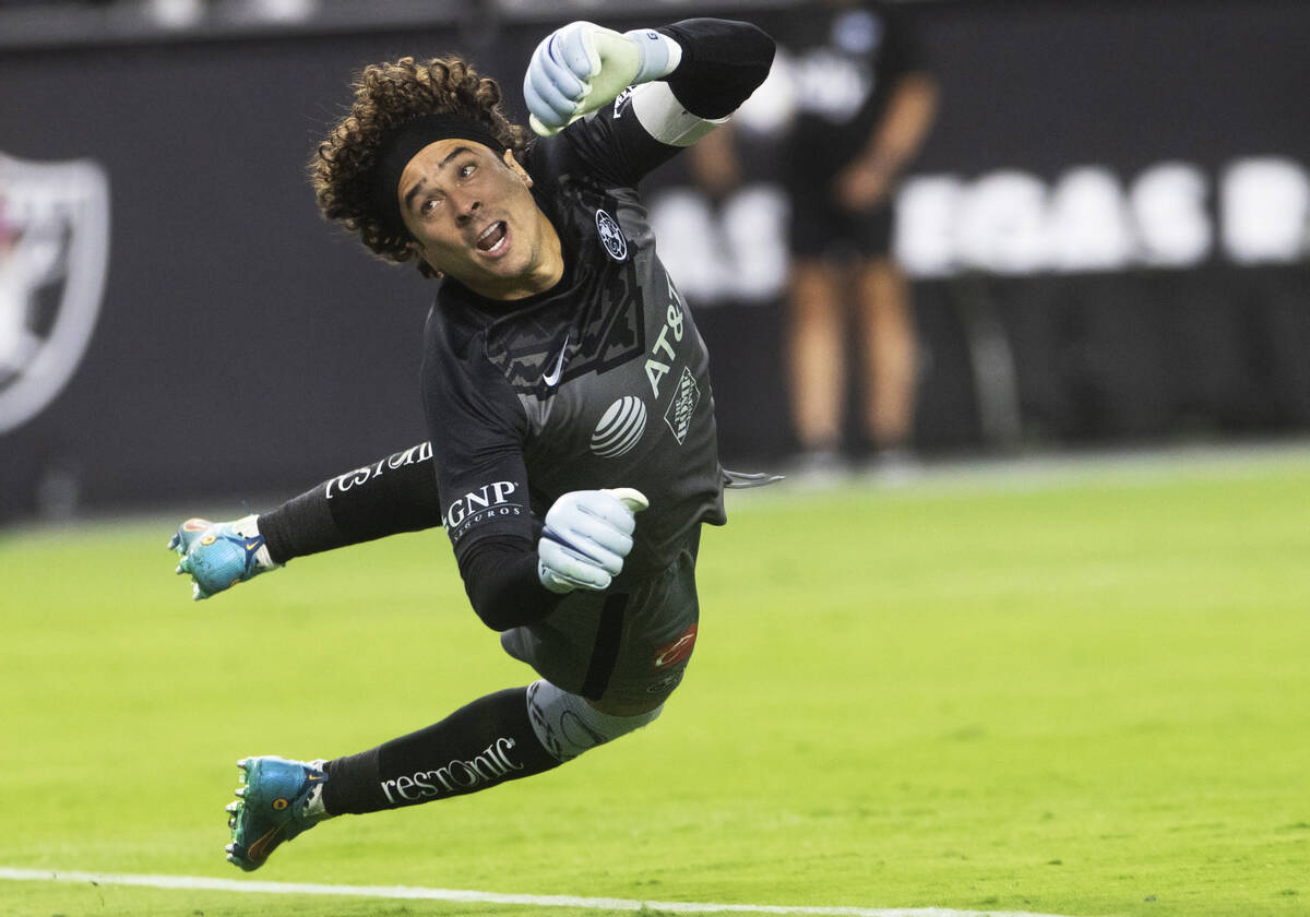 Club América’s Guillermo Ochoa (13) makes a save during a soccer game against Chels ...