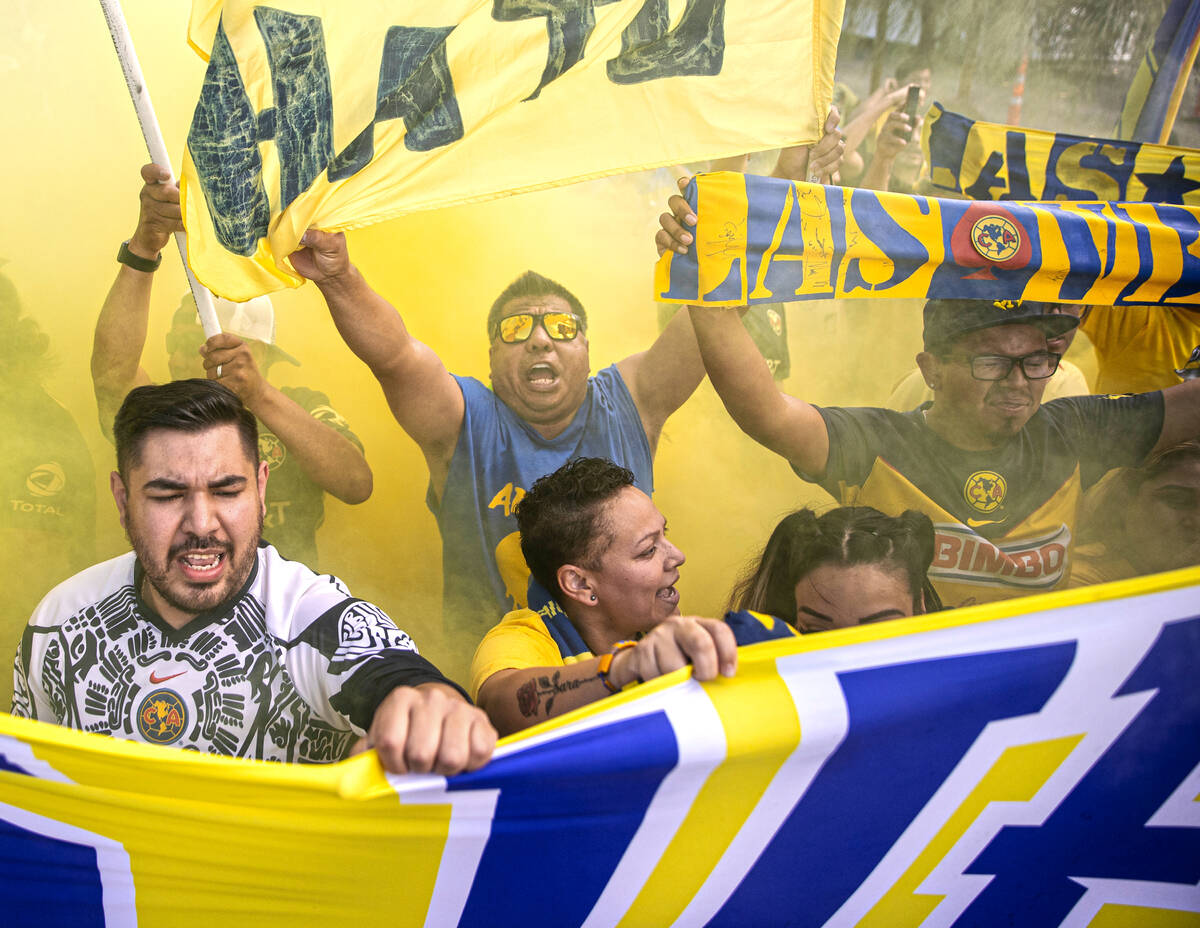 Club América fans cheer outside Allegiant Stadium before the start of a soccer game agains ...