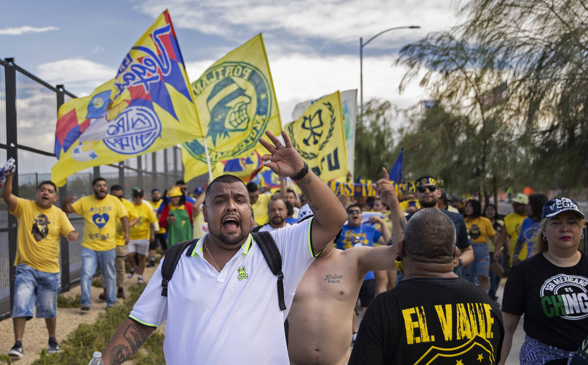 Club América fans cheer outside Allegiant Stadium before the start of a soccer game agains ...