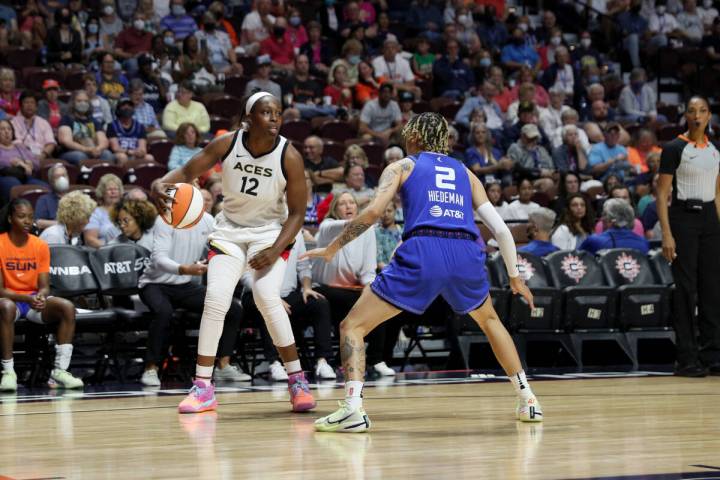 Chelsea Gray #12 of the Las Vegas Aces dribbles the ball during the game against the Connecticu ...