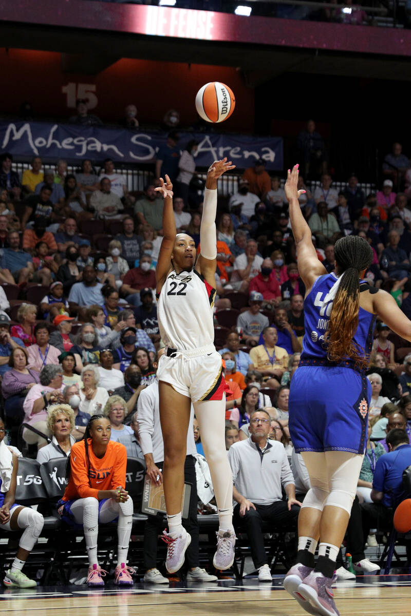A'ja Wilson #22 of the Las Vegas Aces shoots a three point basket during the game against the C ...