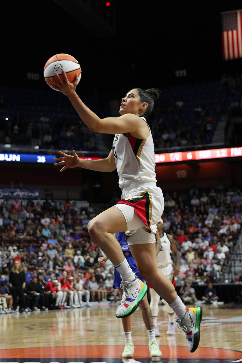 Kelsey Plum #10 of the Las Vegas Aces drives to the basket during the game against the Connecti ...