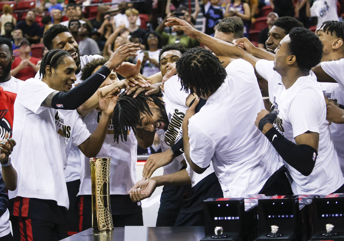 The Portland Trail Blazers celebrate around MVP Trendon Watford, center, after defeating the N ...