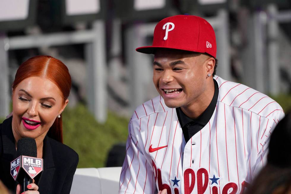 Justin Crawford, right, smiles after being selected by the Philadelphia Phillies with the 17th ...