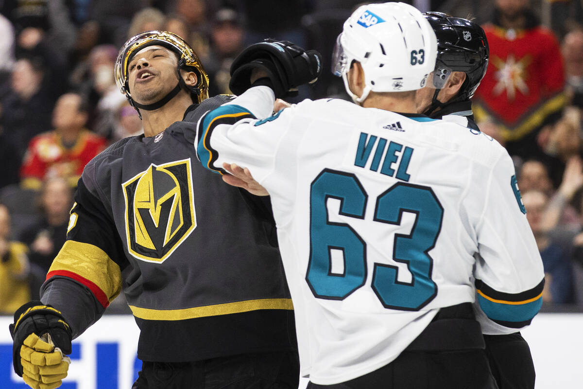 Golden Knights right wing Keegan Kolesar (55) fights San Jose Sharks left wing Jeffrey Viel (63 ...