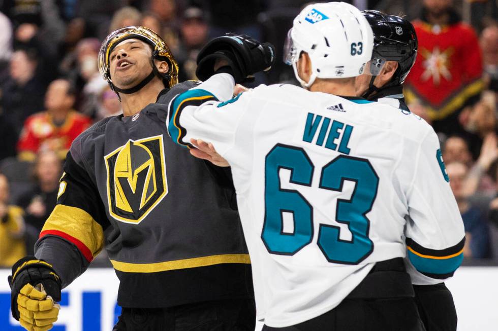 Golden Knights right wing Keegan Kolesar (55) fights San Jose Sharks left wing Jeffrey Viel (63 ...