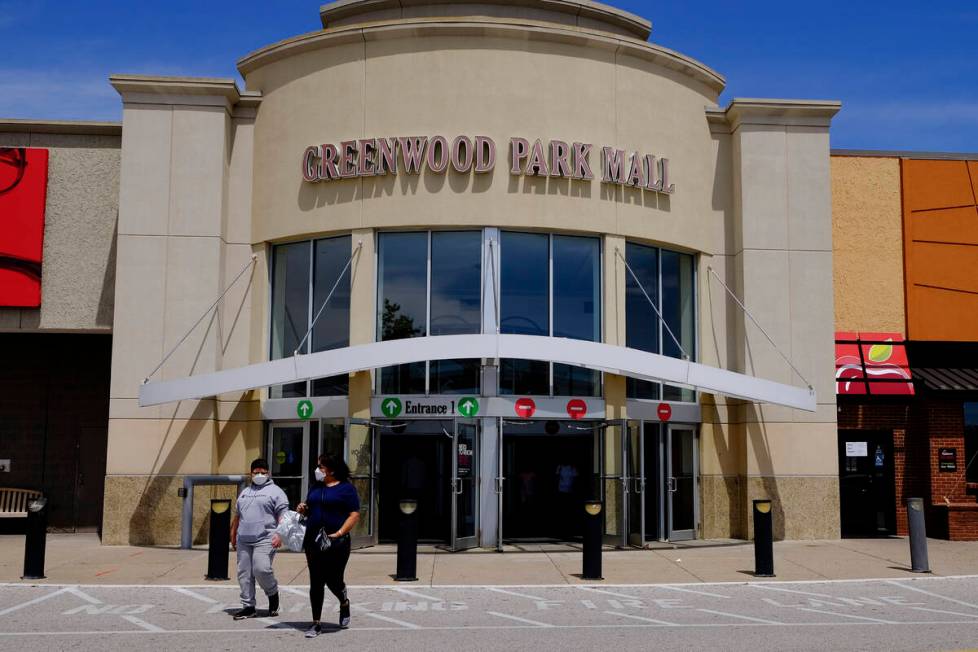 FILE - Shoppers leave the Greenwood Park Mall on May 4, 2020, in Greenwood, Ind. Indianapolis M ...