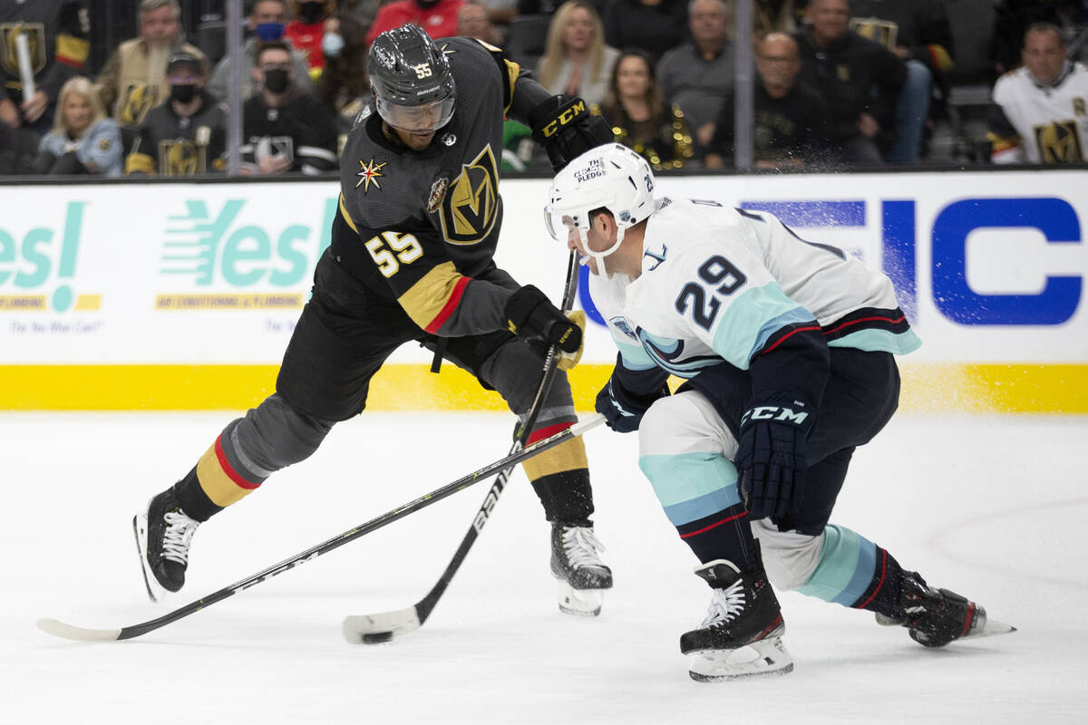 Golden Knights right wing Keegan Kolesar (55) takes a shot on goal defended by Kraken defensema ...