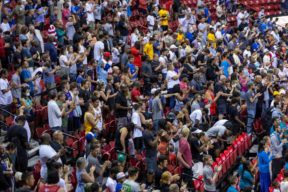 Fans stand an applaud during the first half of their NBA Summer League basketball game the Thom ...