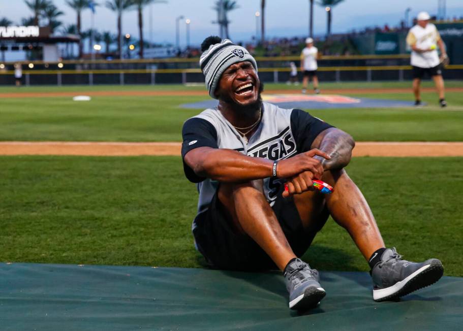 Raiders’ Denzel Perryman reacts during a break in the Battle for Vegas charity softball ...