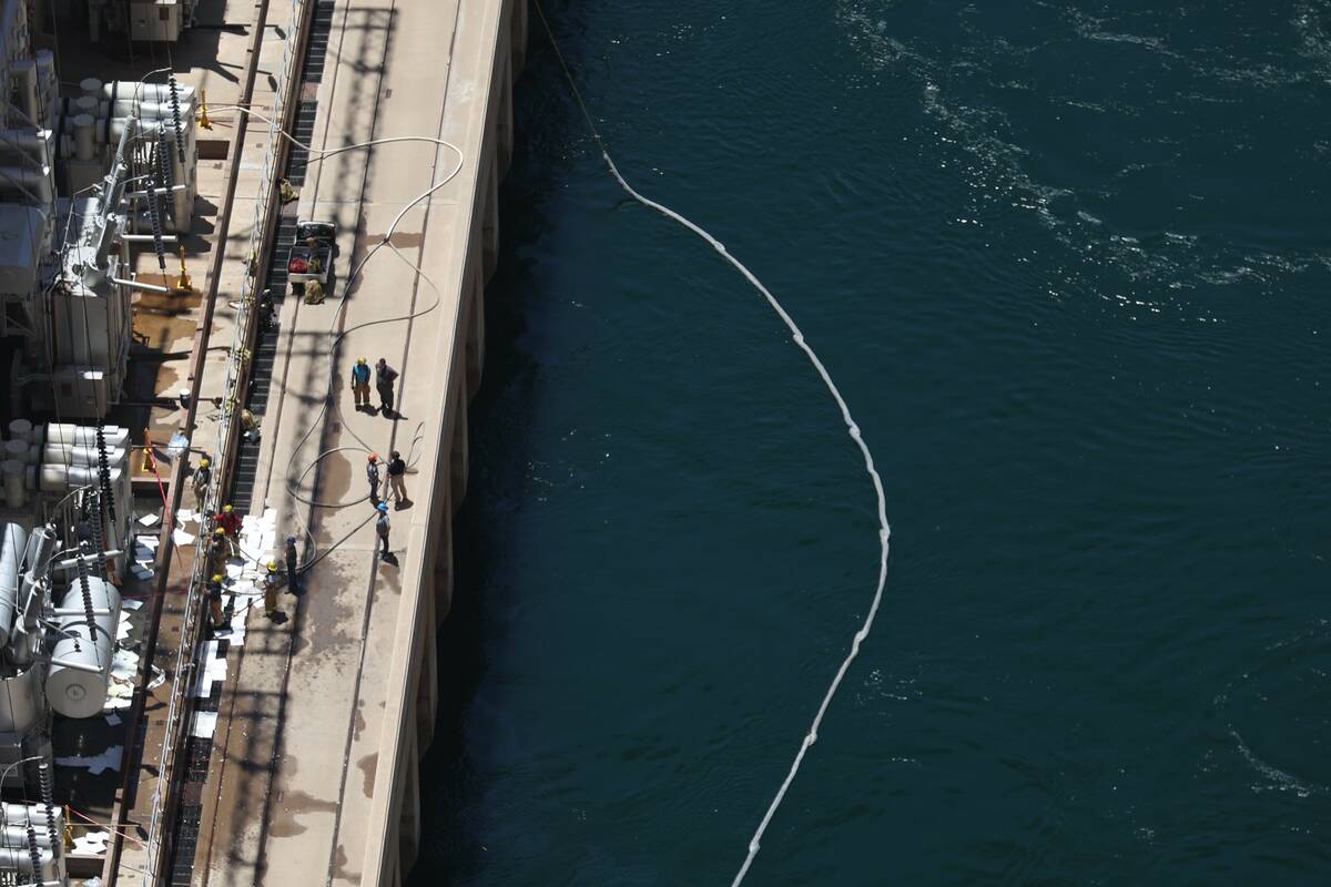 Emergency personnel investigate a transformer that exploded, causing a fire at the Hoover Dam o ...