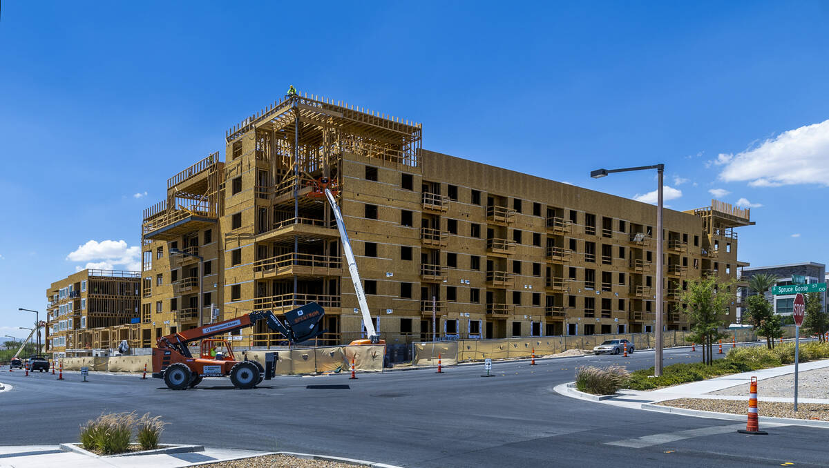 Construction continue on a new apartment building next to the existing Tanager apartment comple ...