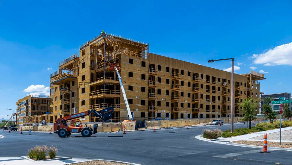 Construction continue on a new apartment building next to the existing Tanager apartment comple ...