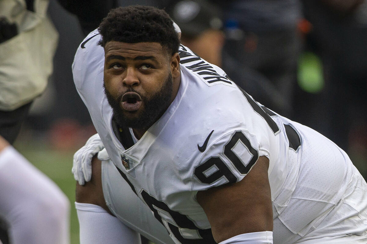 Raiders defensive tackle Johnathan Hankins (90) stretches before an NFL playoff game against th ...