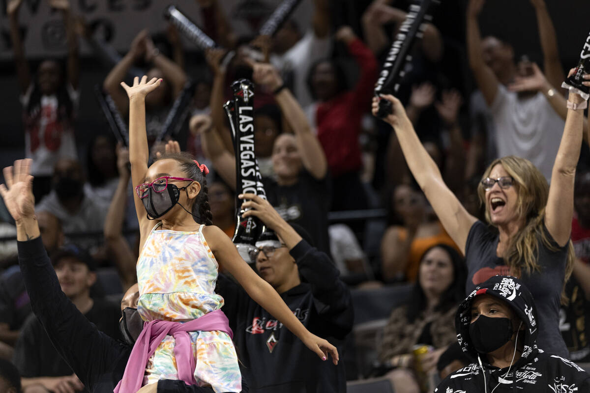 Las Vegas Aces fans cheer for their team during the second half of a WNBA basketball game again ...