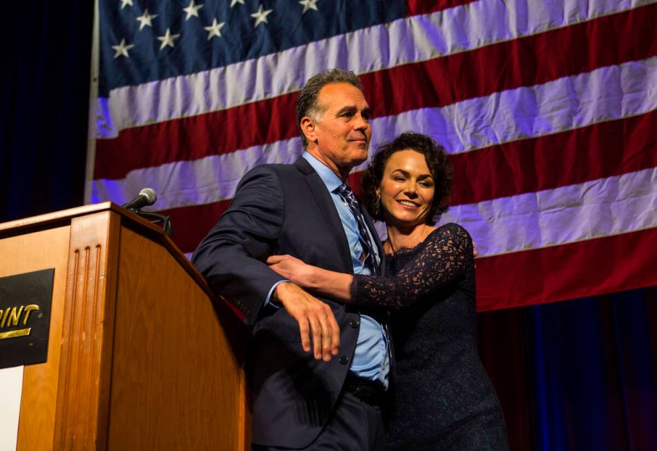 Amy Tarkanian comforts her husband Danny Tarkanian, Republican candidate for the 3rd Congressio ...