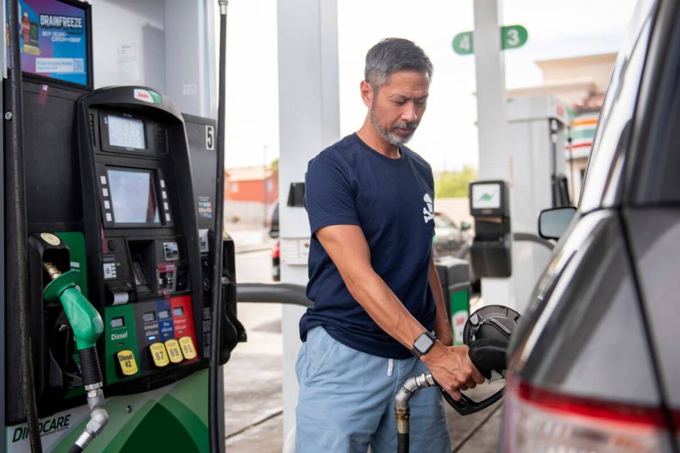 Tony Rodriguez, from San Fransisco, Calif., pumps gas at a Sinclair station on South Fort Apach ...