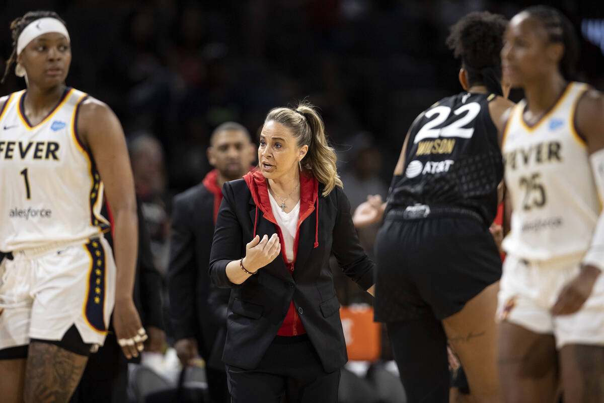 Las Vegas Aces head coach Becky Hammon communicates with a referee during the first half of a W ...