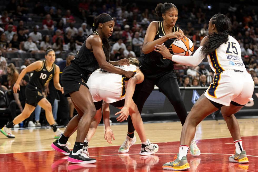 Las Vegas Aces center Iliana Rupert (21) gains control of the ball from Indiana Fever guard Tif ...