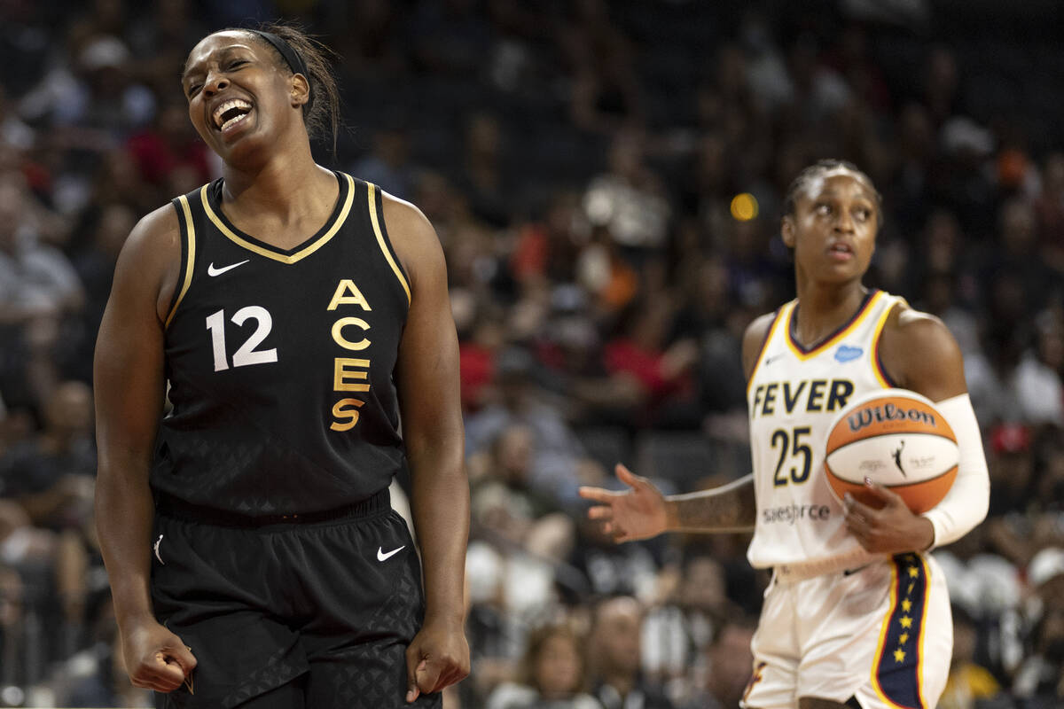 Las Vegas Aces guard Chelsea Gray (12) and Indiana Fever guard Tiffany Mitchell (25) react to a ...