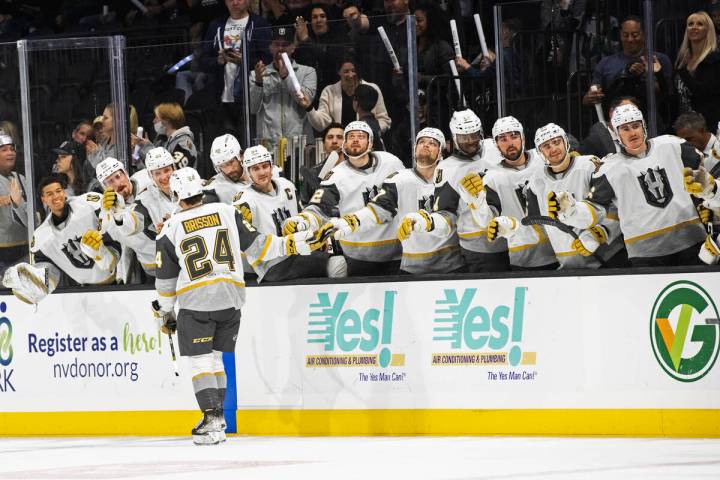 Silver Knights forward Brendan Brisson (24) celebrates with teammates after scoring in the firs ...