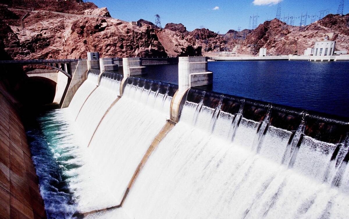Hoover Dam's Arizona side spillway is seen as water flows over in fall 1983. (Las Vegas Review- ...
