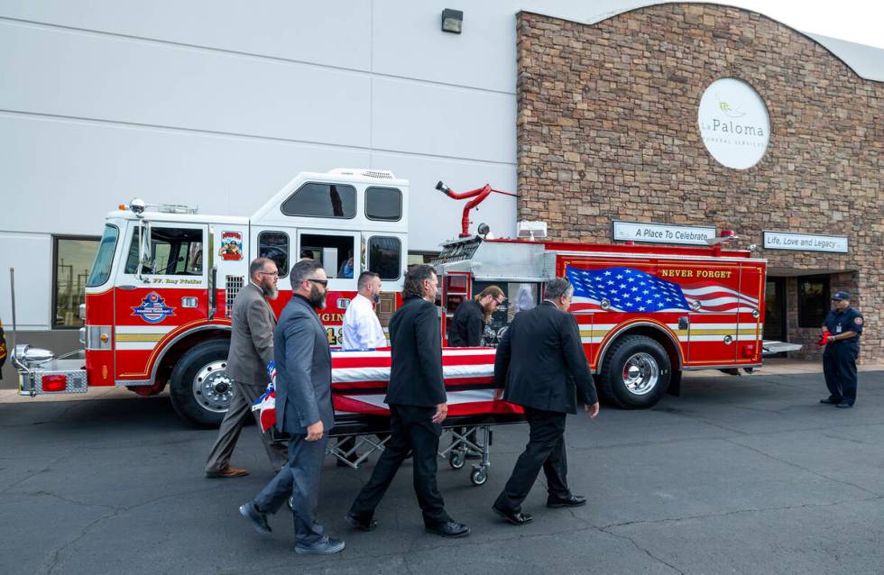 The casket of Las Vegas Fire & Rescue Capt. Dennis Egbert is carried to the Raymond J. Pfei ...