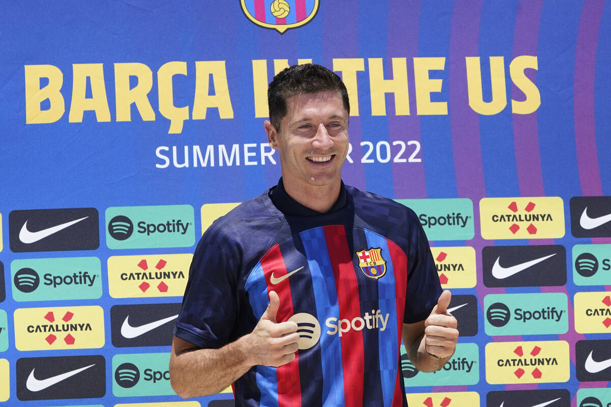 Robert Lewandowski wears his new FC Barcelona soccer jersey, Wednesday, July 20, 2022, in Fort ...