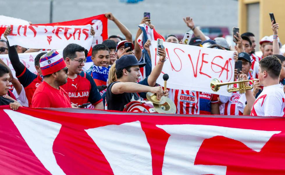 Chivas Guadalajara fans march and chant before the first half of their soccer game versus Juven ...