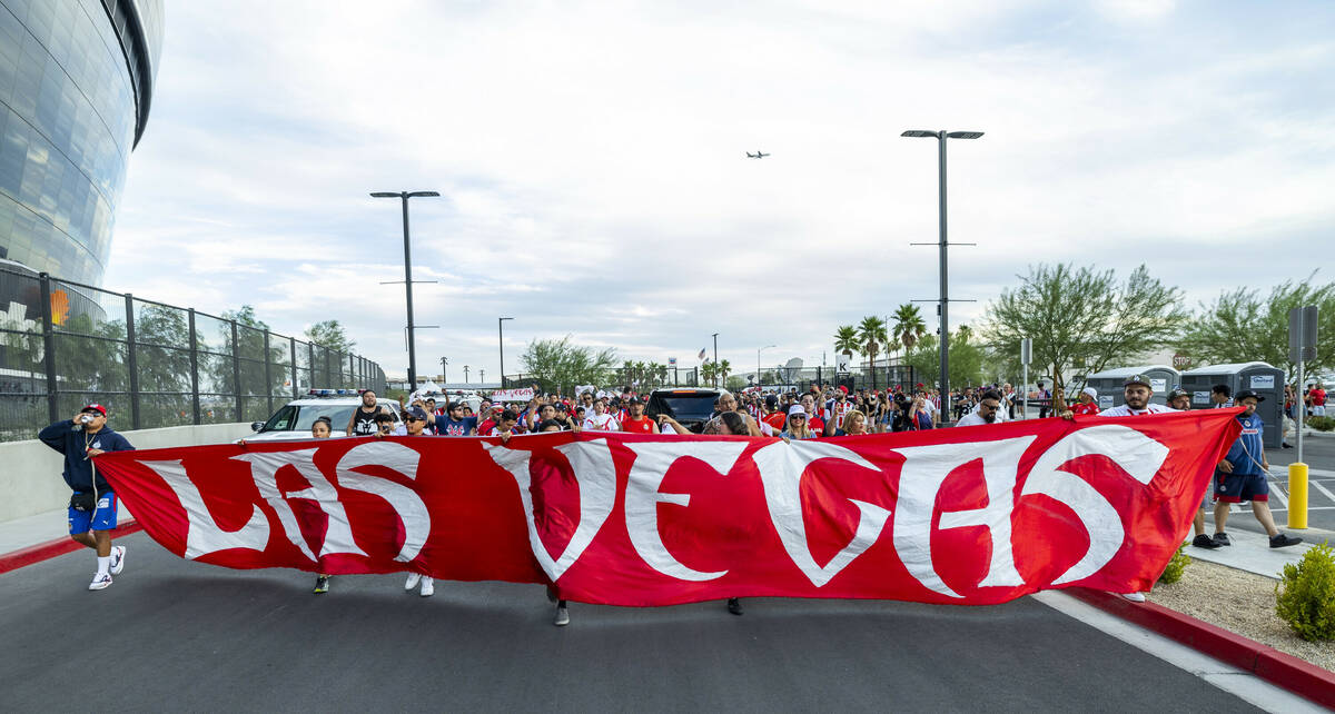 Chivas Guadalajara fans march and chant before the first half of their soccer game versus Juven ...