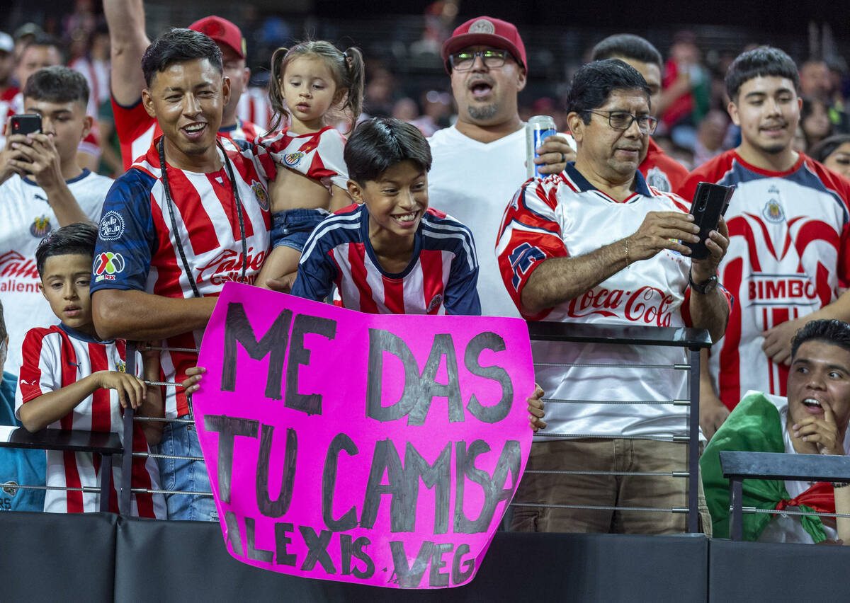Chivas Guadalajara fans hope for a jersey from their players versus Juventus during the first h ...