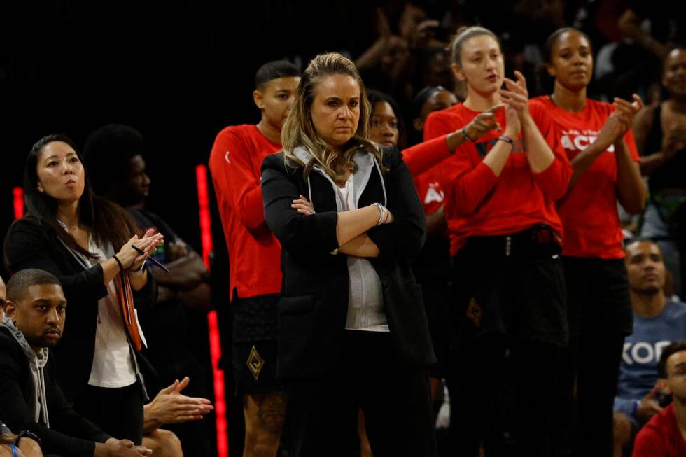 Las Vegas Aces head coach Becky Hammon, center, watches her players during the third quarter of ...