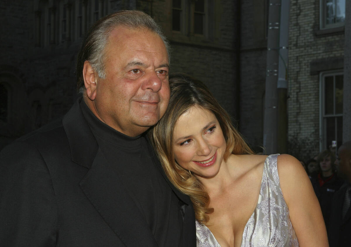 FILE - Mira Sorvino, right and father Paul Sorvino attend the premiere of "Reservation Roa ...