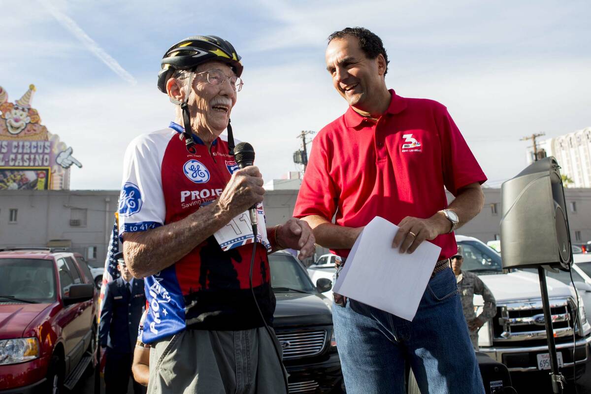 Emmett Scott Prothero, World War II veteran, left, and Kevin Janison, meteorologist for NBC 3, ...