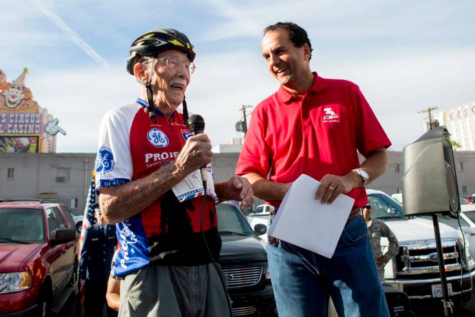 Emmett Scott Prothero, World War II veteran, left, and Kevin Janison, meteorologist for NBC 3, ...