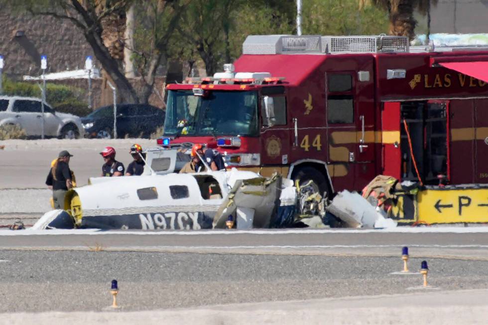 Officials investigate the wreckage of a plane at the site of a fatal crash at the North Las Veg ...