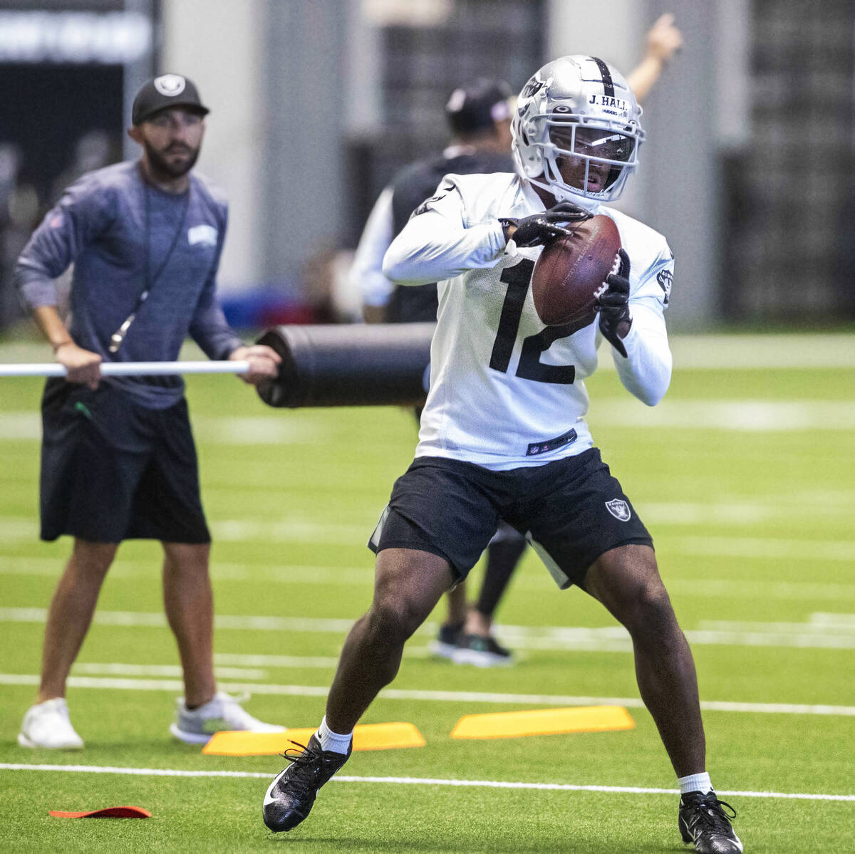 Raiders wide receiver Justin Hall (12) makes a catch during the team’s training camp pra ...