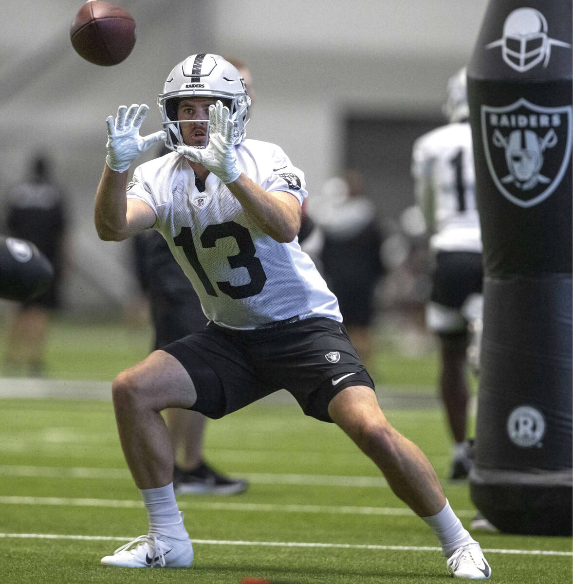 Raiders wide receiver Hunter Renfrow (13) makes a catch during the team’s training camp ...