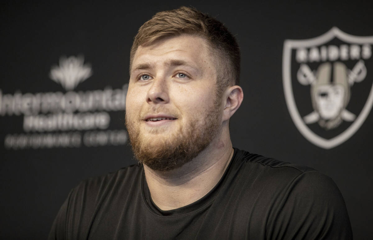 Raiders offensive tackle Kolton Miller listens to media questions during a news conference at t ...