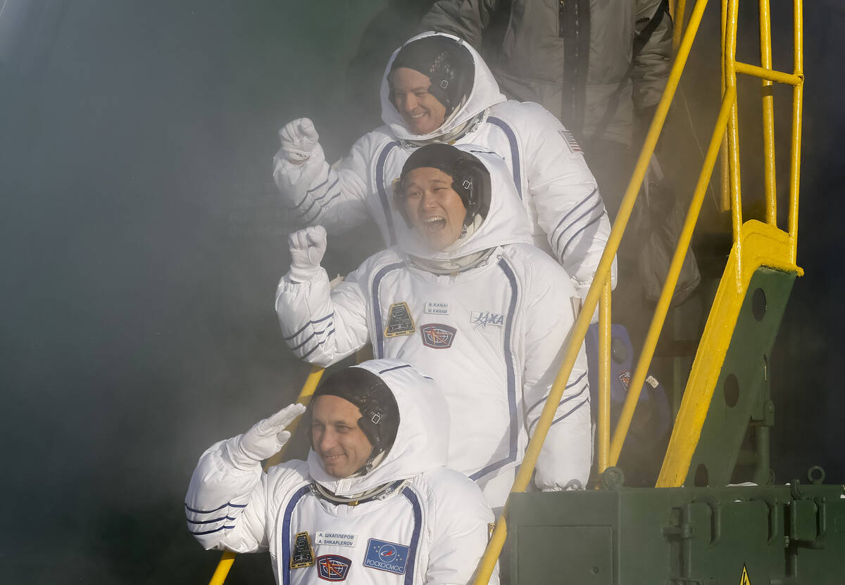 FILE - Russian cosmonaut Anton Shkaplerov, bottom, U.S. astronaut Scott Tingle, above, and Japa ...