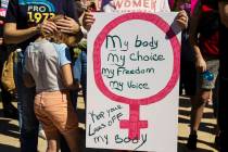 Demonstrators gather outside the Lloyd D George Courthouse during a March for Reproductive Righ ...