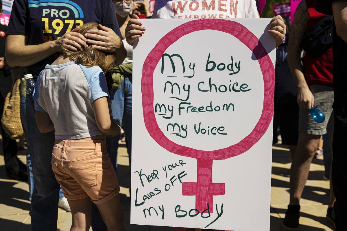 Demonstrators gather outside the Lloyd D George Courthouse during a March for Reproductive Righ ...